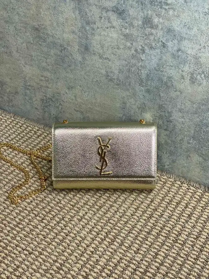Saint Laurent gold leather crossbody bag catalog photo