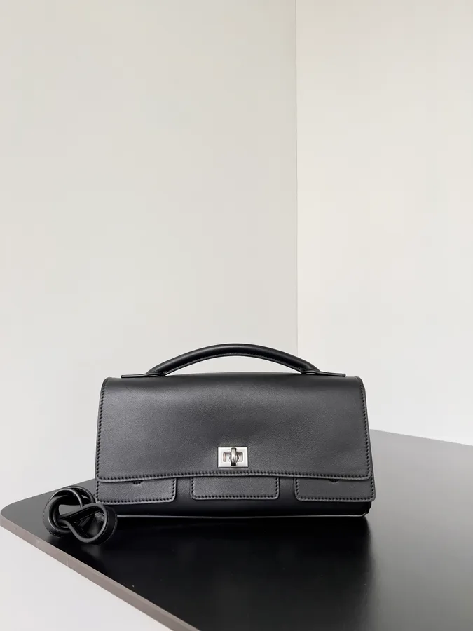 Balenciaga mini flap bag in black calfskin with silver-tone hardware and a short strap