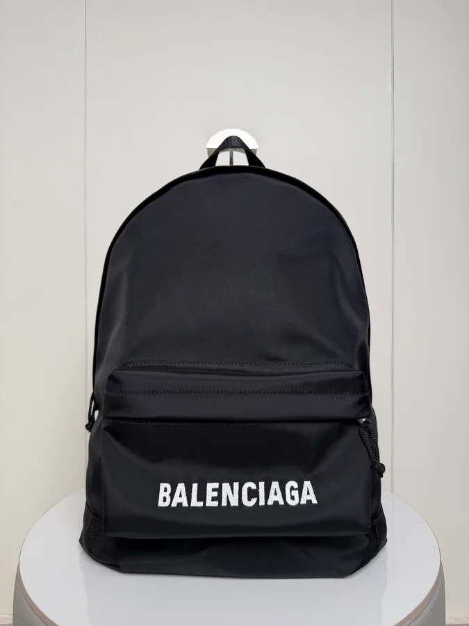 Balenciaga travel backpack in black nylon with a rounded top and padded adjustable straps