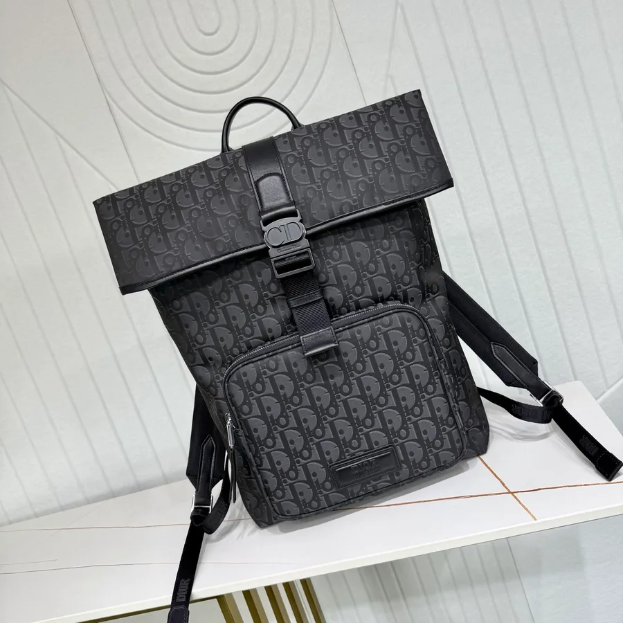 Sac de voyage Dior en toile noire avec anses à main et bandoulière