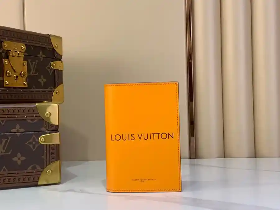 Louis Vuitton orange leather wallet catalog photo