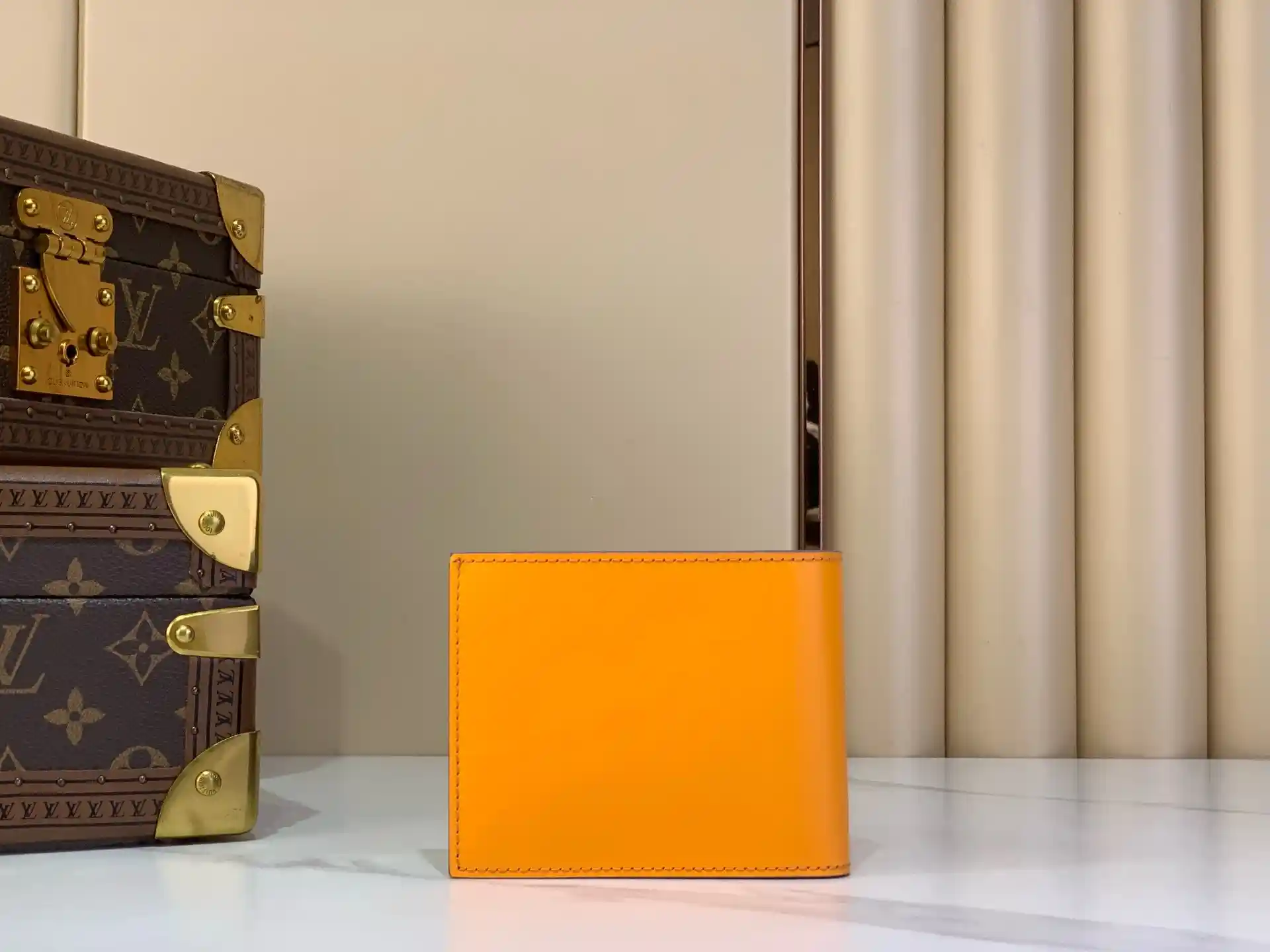 Louis Vuitton orange leather wallet catalog photo