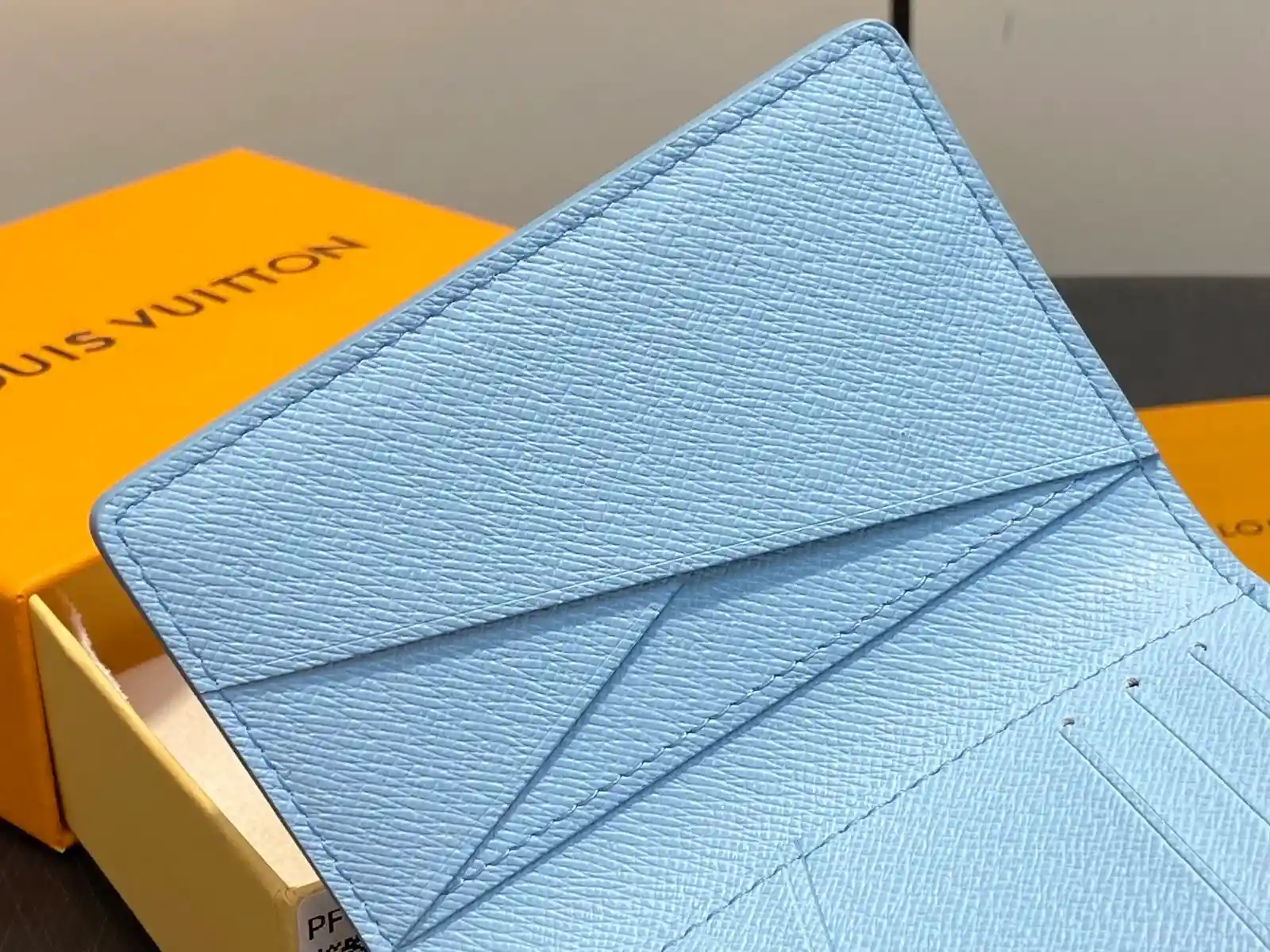 Louis Vuitton washed blue caviar-grained leather wallet catalog photo