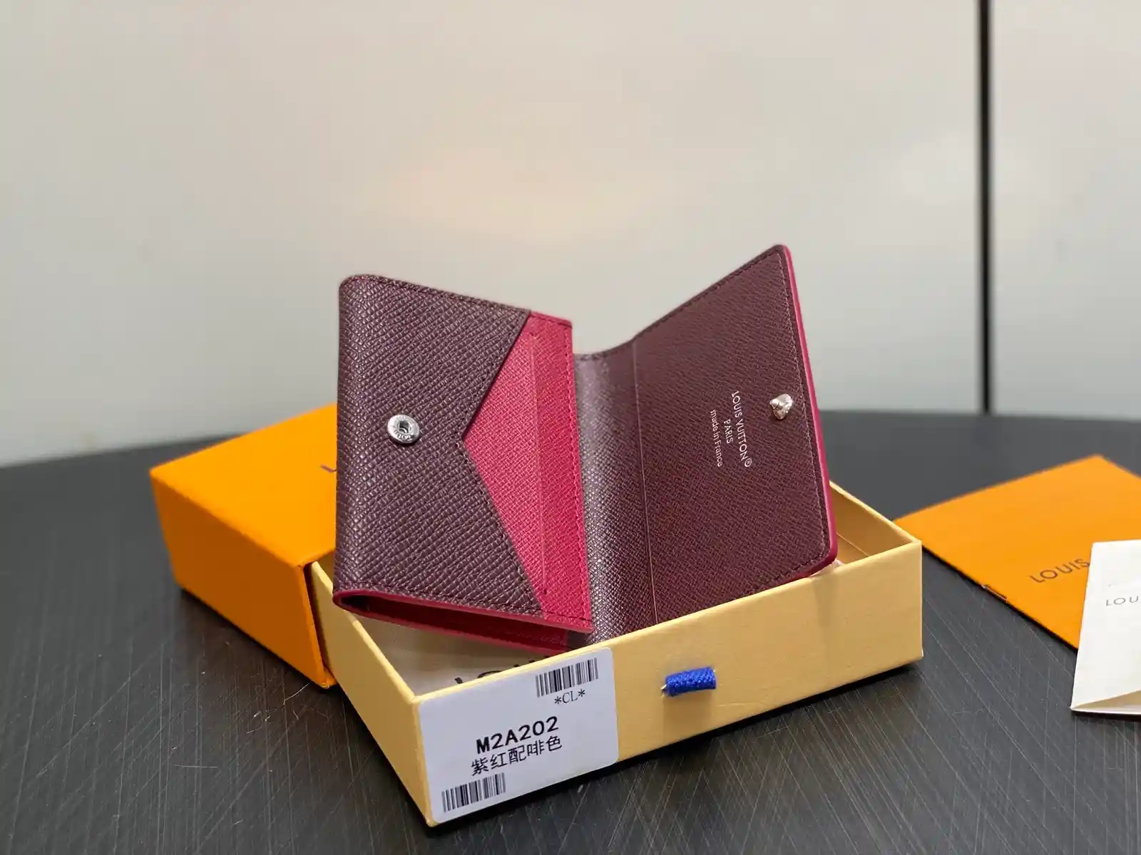 Louis Vuitton burgundy caviar-grained leather wallet catalog photo