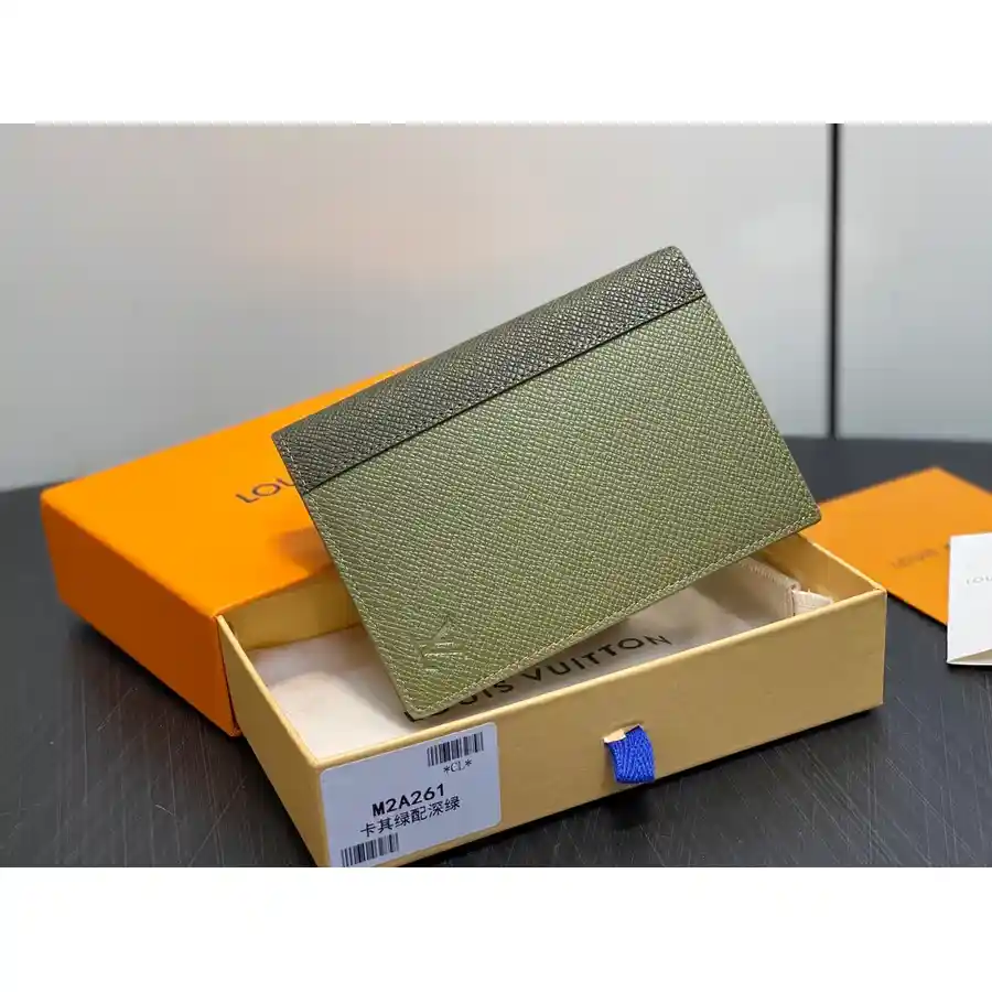 Louis Vuitton green caviar-grained leather wallet catalog photo
