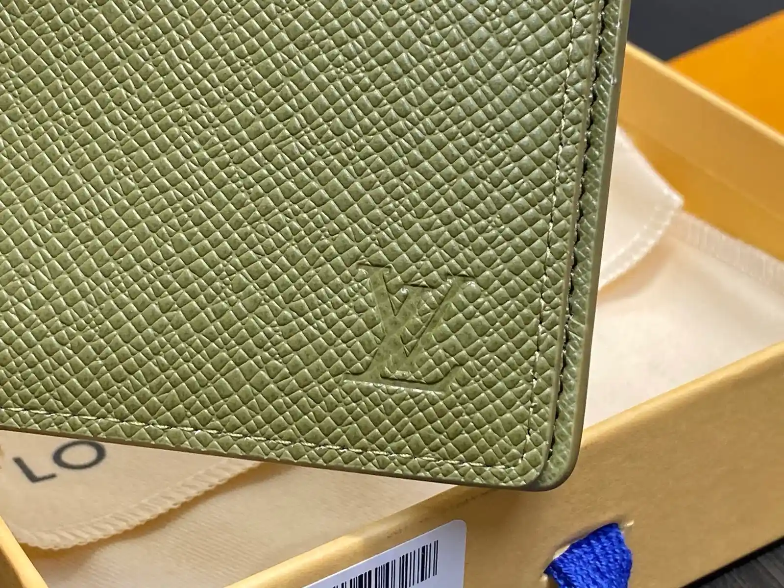 Louis Vuitton green caviar-grained leather wallet catalog photo