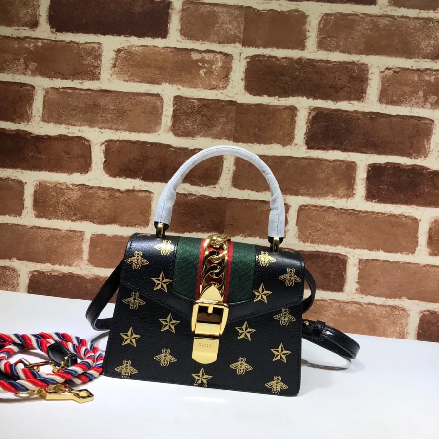 Gucci small bag catalog photo with bee detail