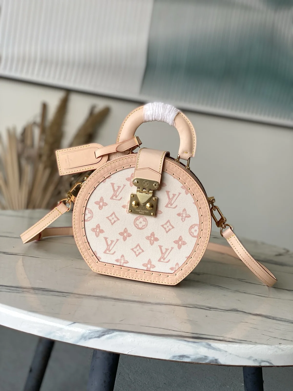 LV Boîte Chapeau small hat box in Monogram canvas with leather trim — front view