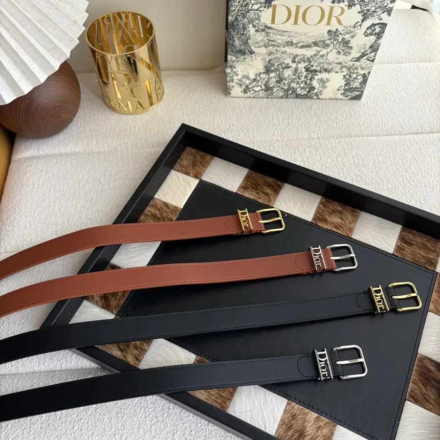 Brown leather Dior belt with a metal buckle, shown flat against a plain background