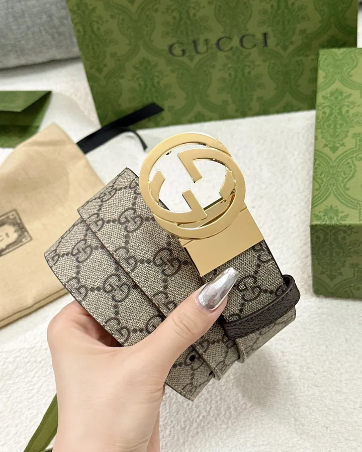 Gucci beige and brown GG monogram canvas belt with a gold-tone interlocking G cut-out buckle and a dark leather keeper loop, from the GunongTrade catalog