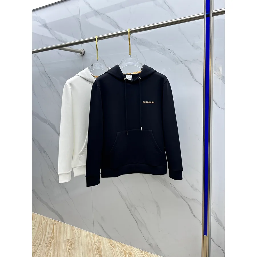 Navy Burberry hooded sweatshirt photographed flat for a catalogue listing