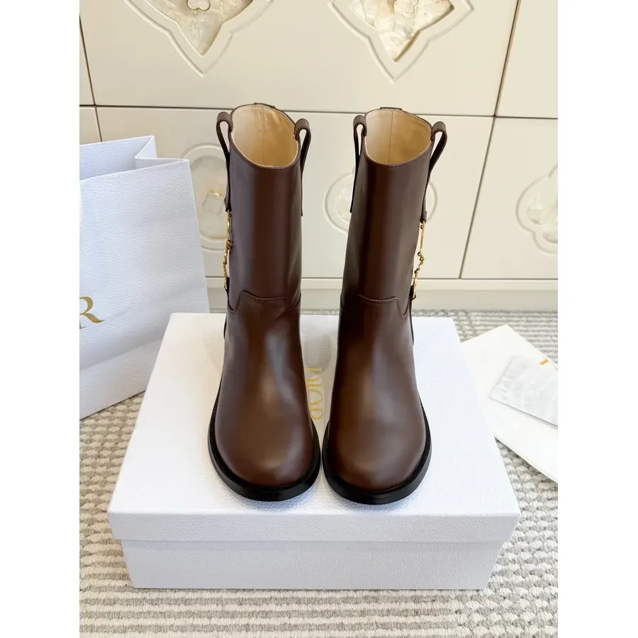Brown leather Dior boot shown at a three-quarter angle with the shaft rising above the ankle