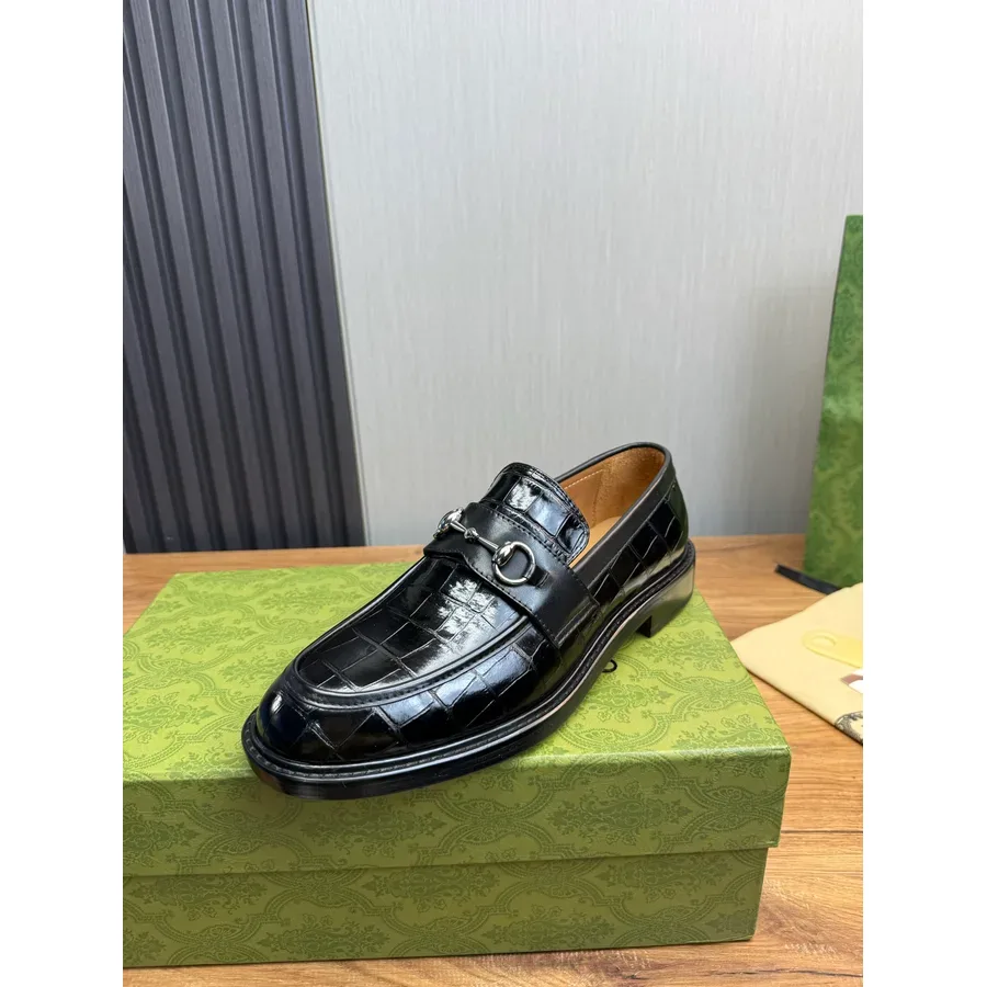 Black croc-embossed leather loafer with a silver horsebit and a black sole