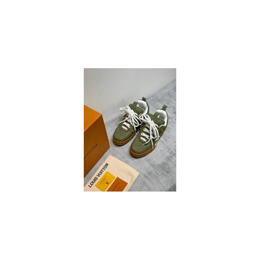 Single LV Trainer sneaker shown side-on, olive green perforated upper with white laces and a tan rubber sole