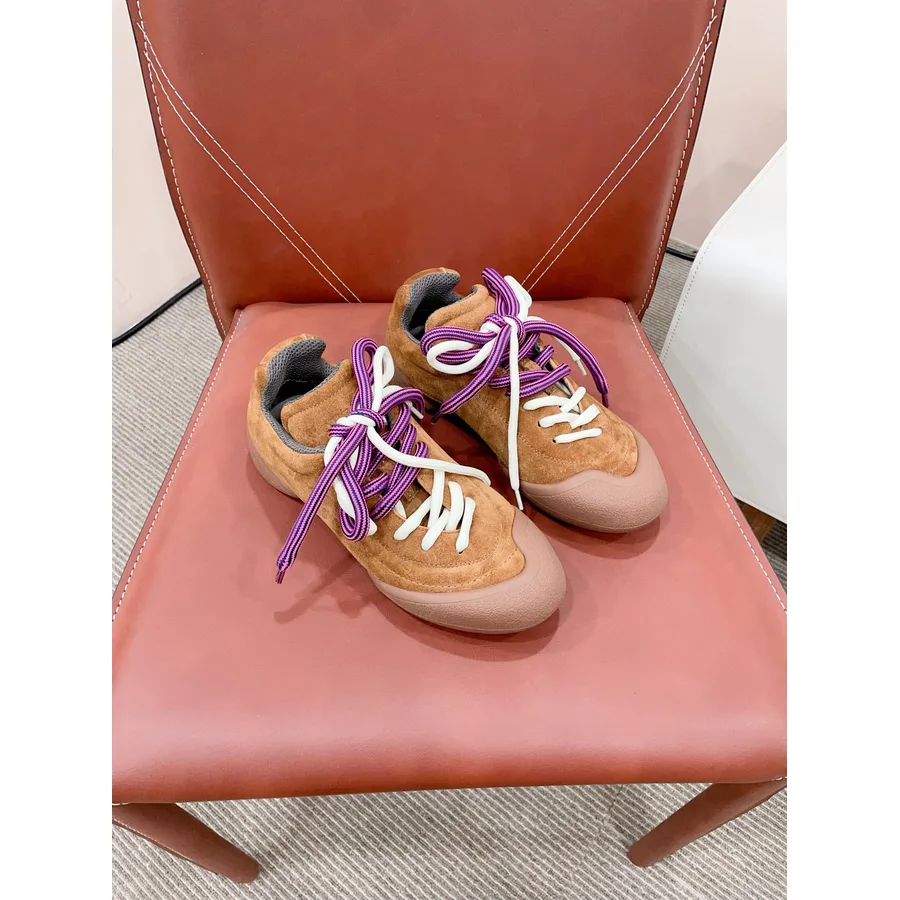 Tan suede low-top sneaker with smooth contrasting toe cap, purple and white rope laces and a thick rubber sole, from the GunongTrade catalog